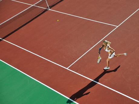 young woman play tennis outdoor