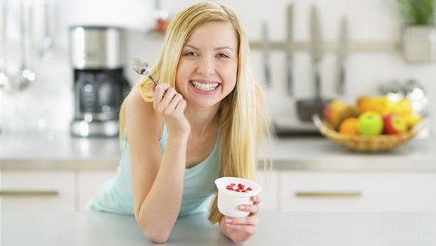 Woman eating yogurt