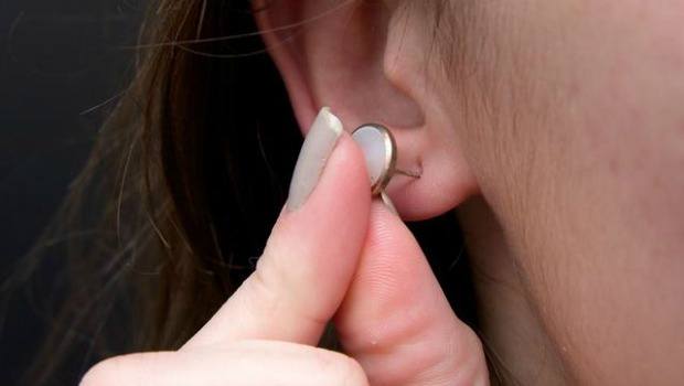 inserting earrings