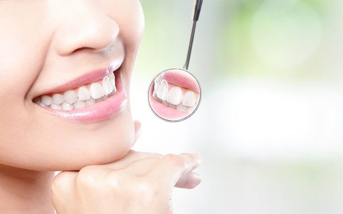 how to look young - maintain healthy teeth