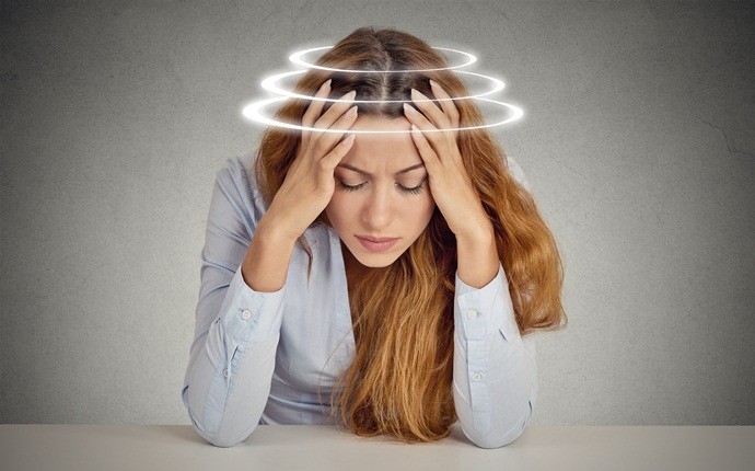 signs of dehydration - lightheadedness and headaches